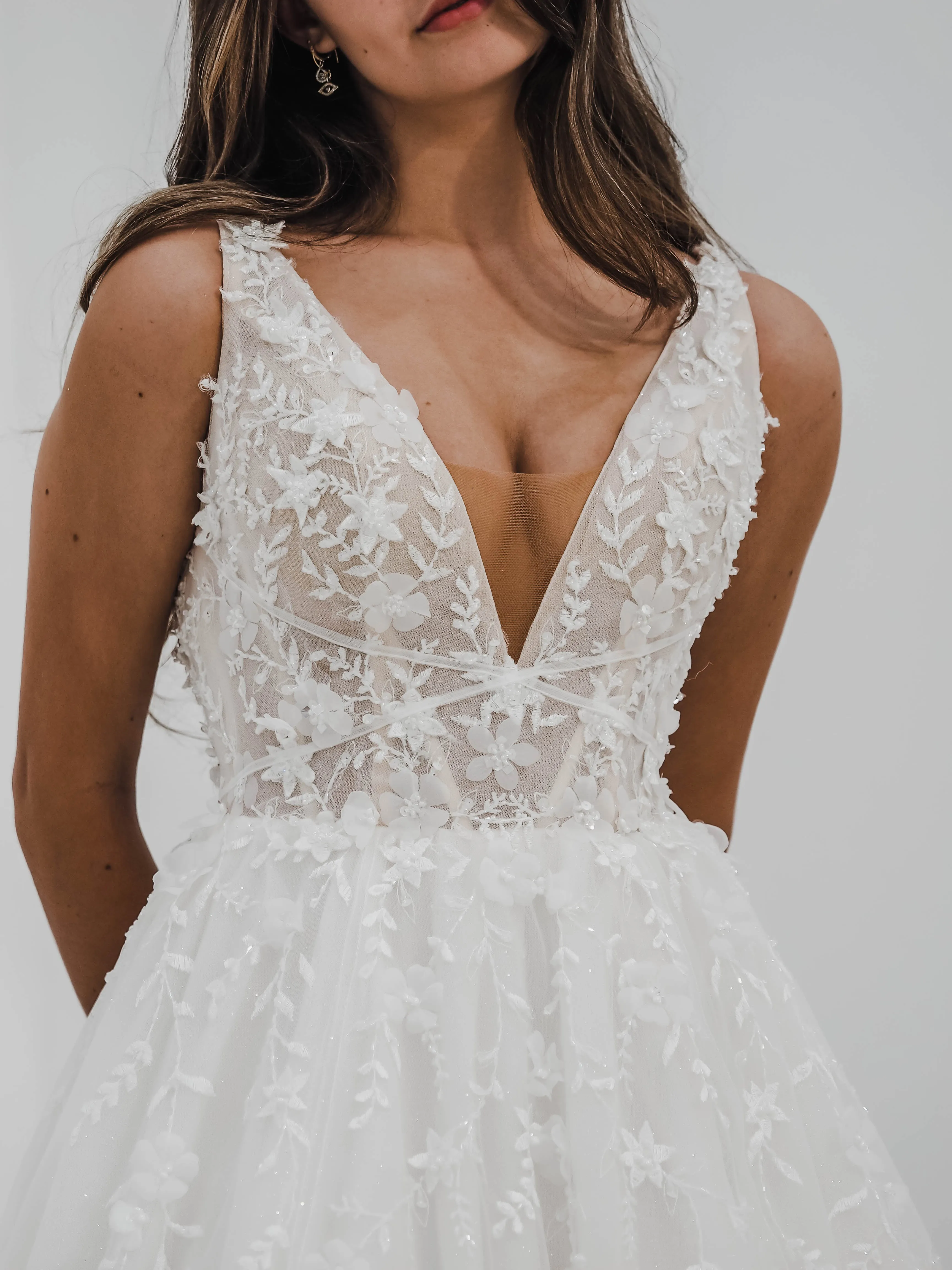 Sparkling white V neck wedding dress with open back for hire