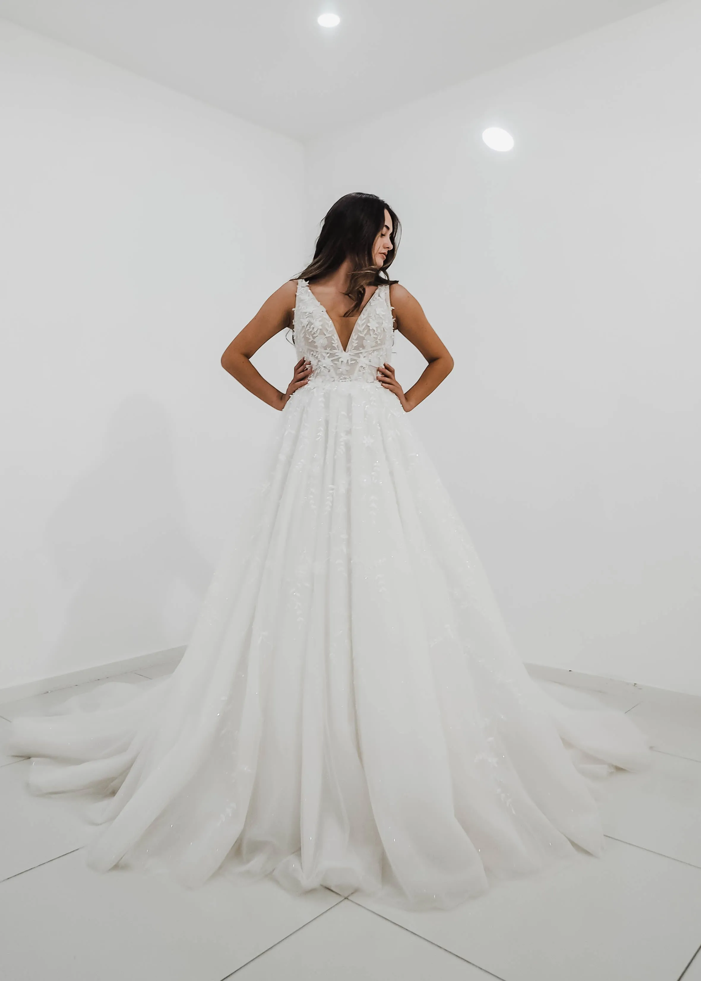 Sparkling white V neck wedding dress with open back for hire