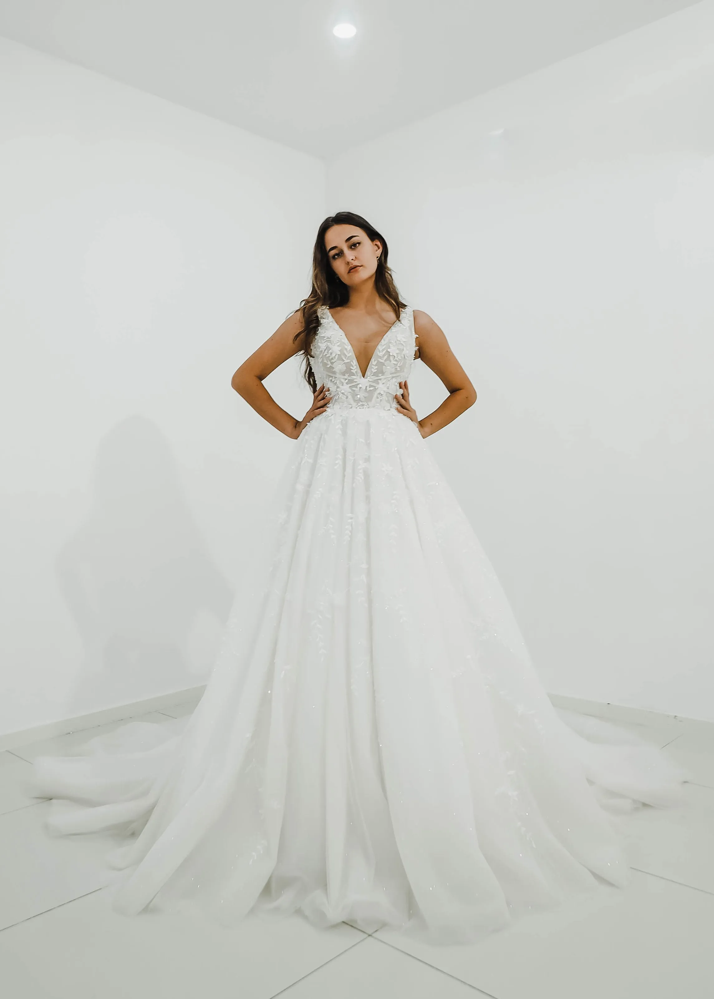 Sparkling white V neck wedding dress with open back for hire