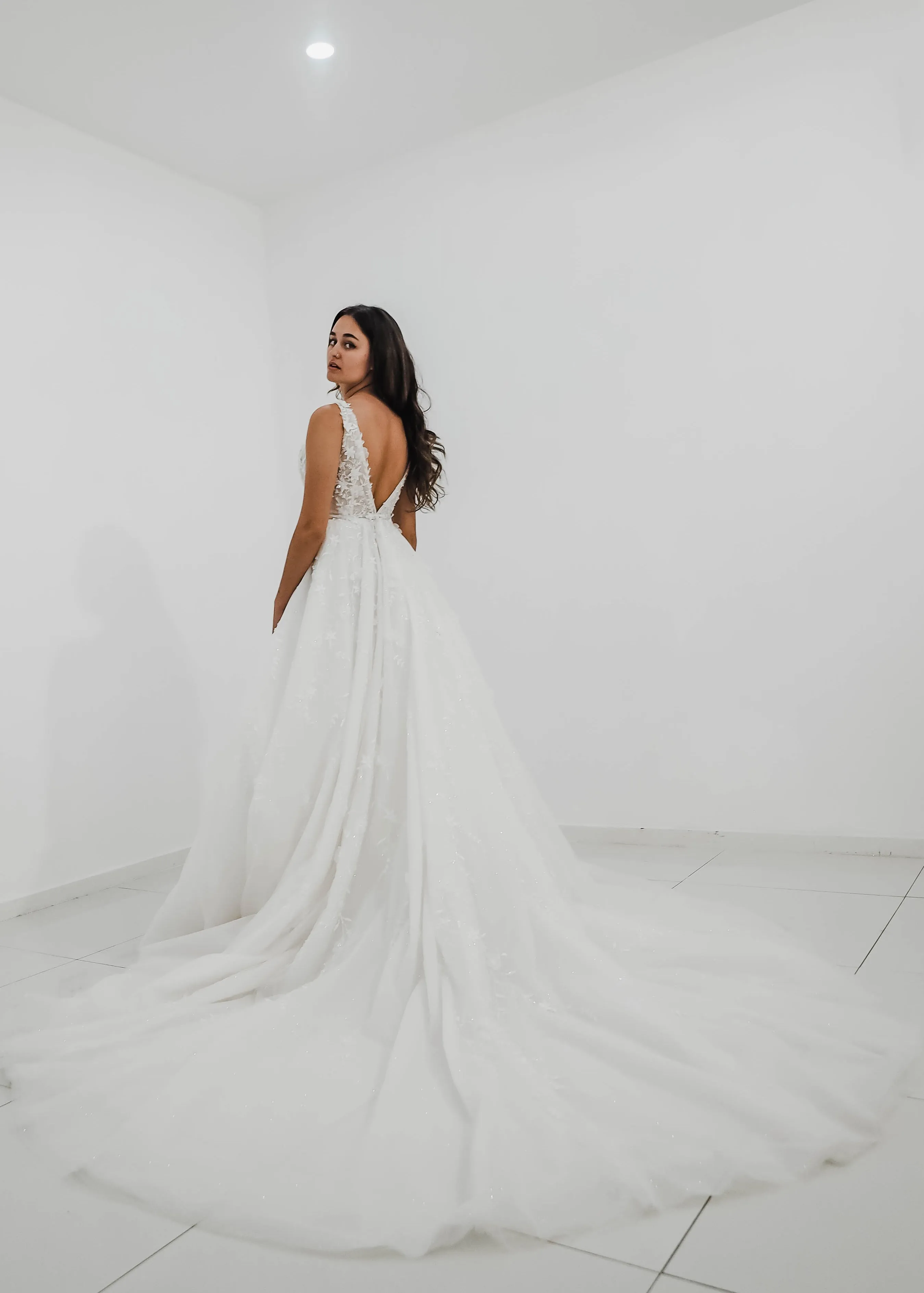 Sparkling white V neck wedding dress with open back for hire