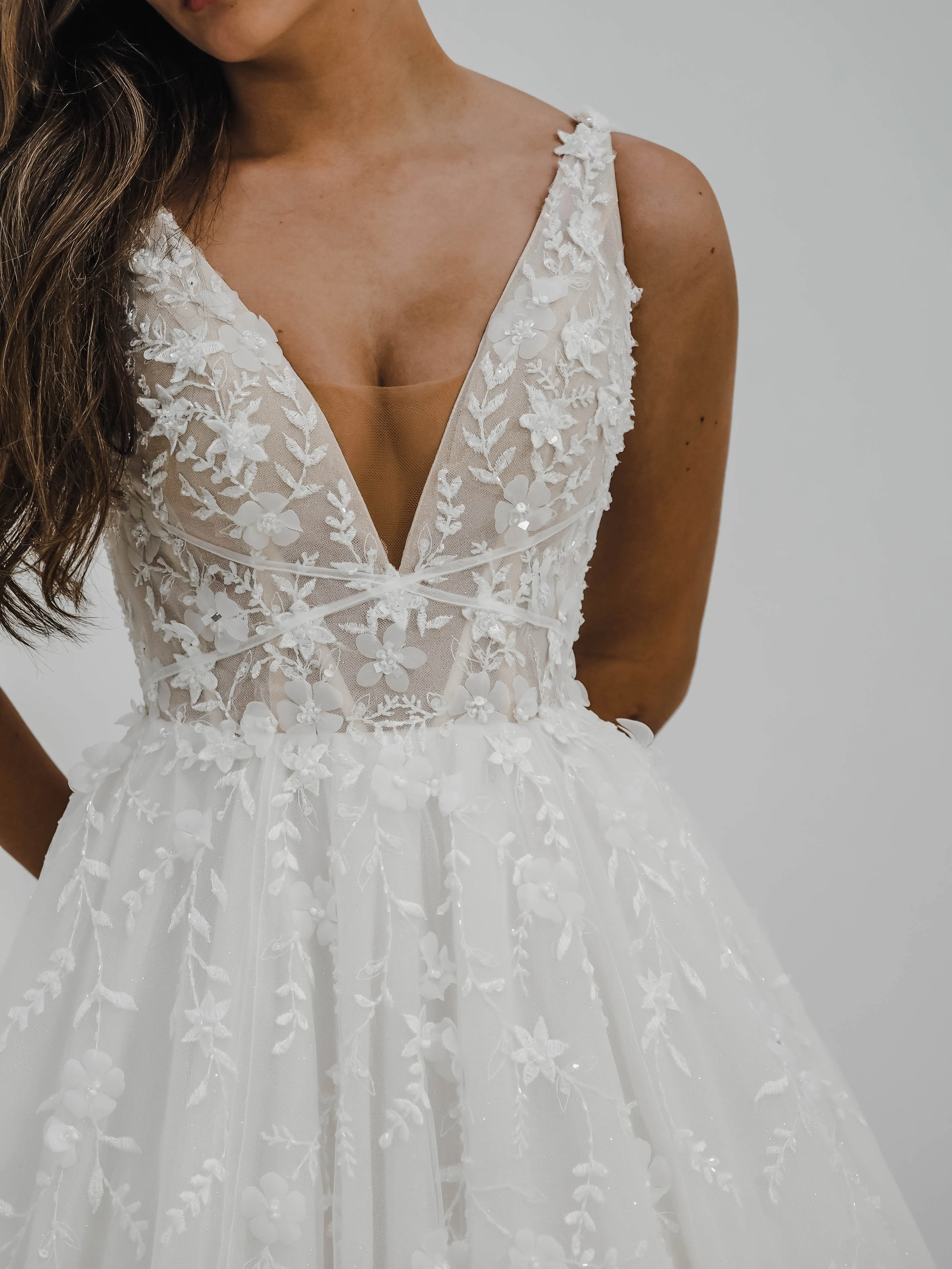 Sparkling white V neck wedding dress with open back for hire